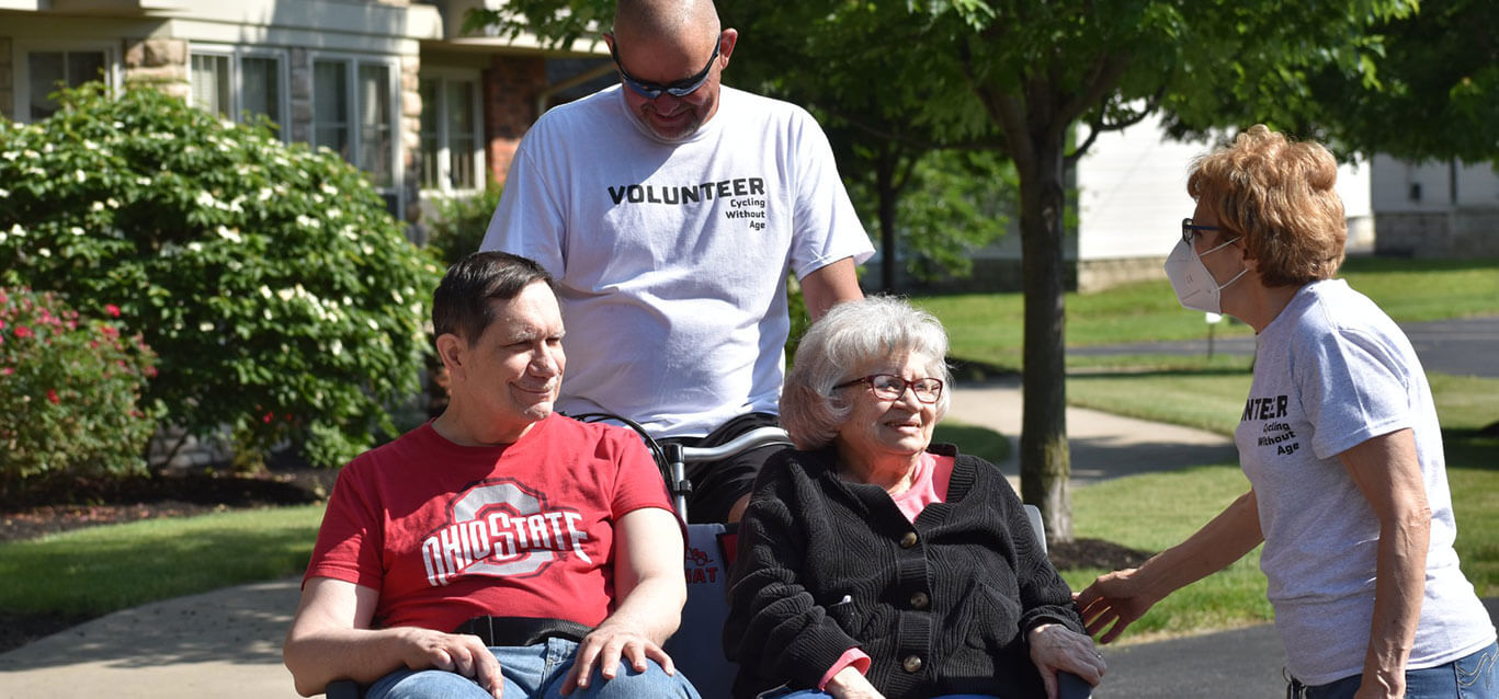 Volunteers cycling with seniors